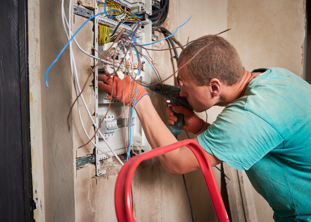 male electrician repairing electrical panel with p 2023 02 16 01 29 12 utc scaled