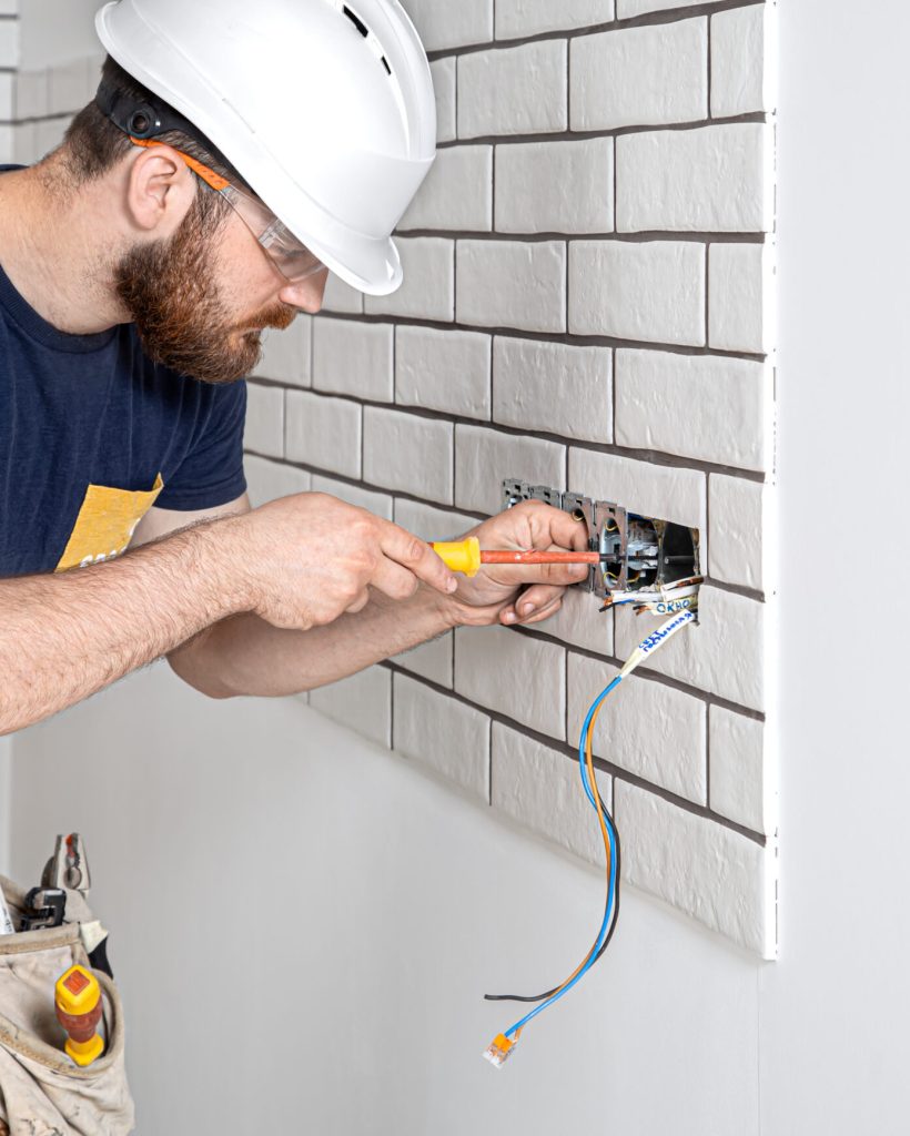 electrician builder at work installation of socke 2021 09 02 14 56 24 utc 1 scaled